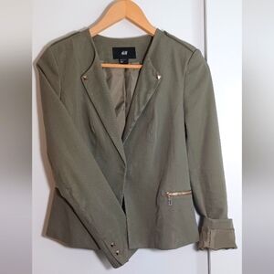 H&M Olive Blazer. Brass stud and 2 front zipper pockets.  Size 8.